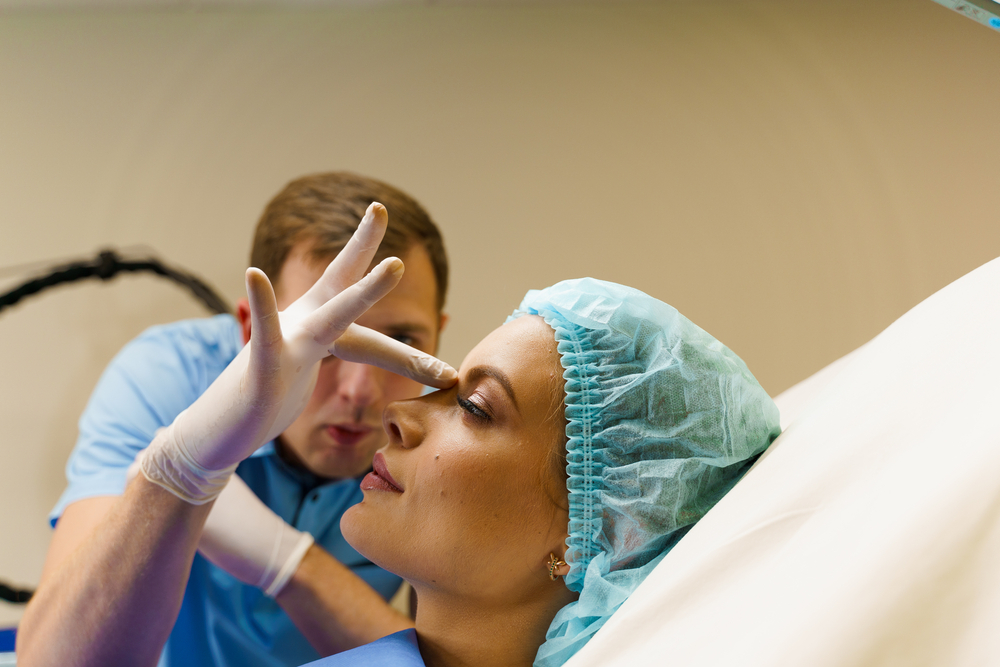 Doctor touches nose of patient